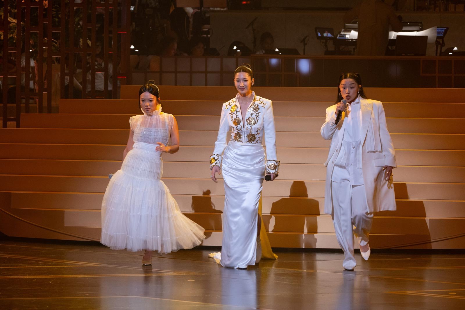 Rei Ami, EJAE, and Audrey Nuna perform "Golden" onstage during the 98th Oscar